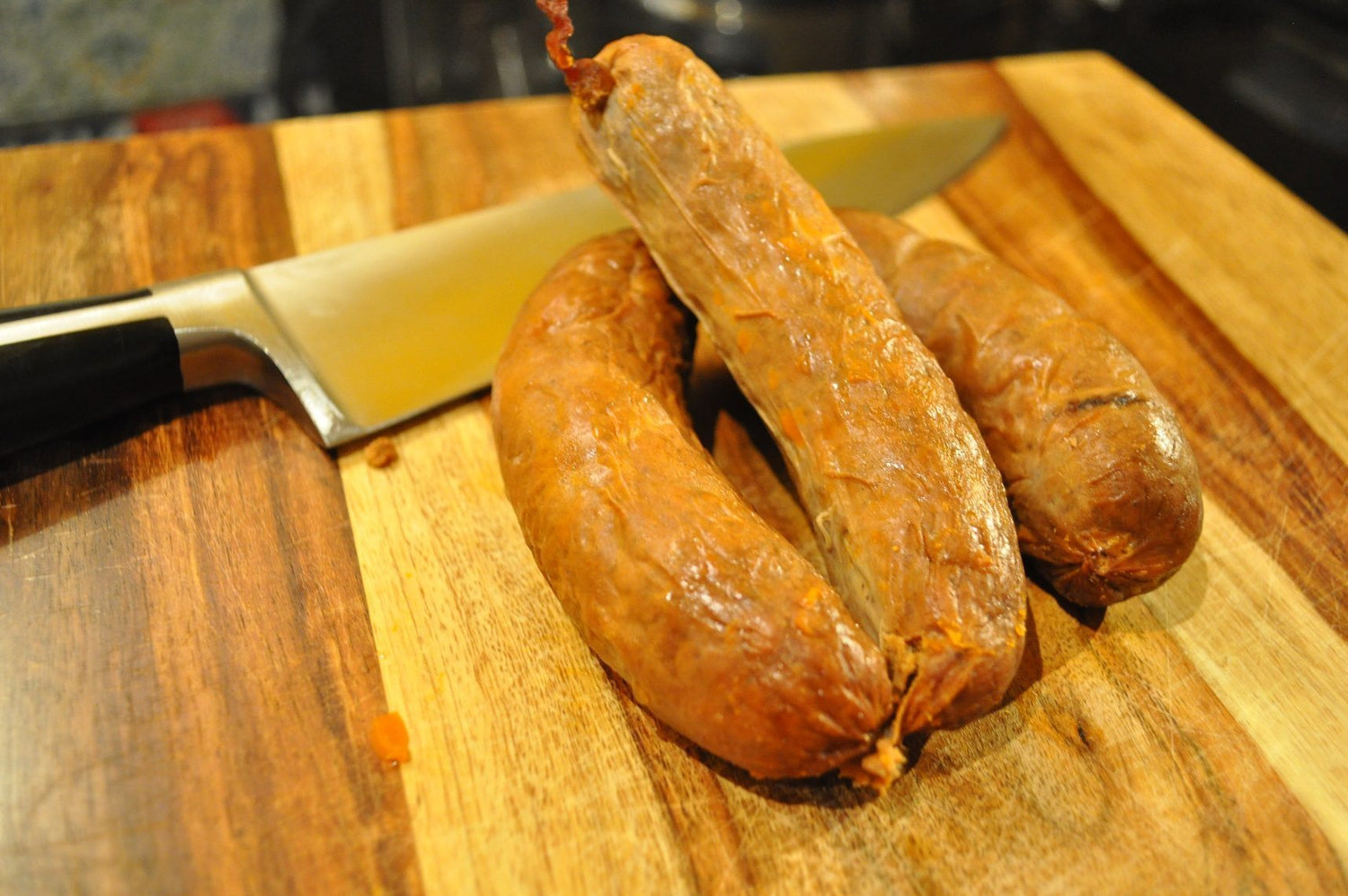 Chorizo and knife on cutting board